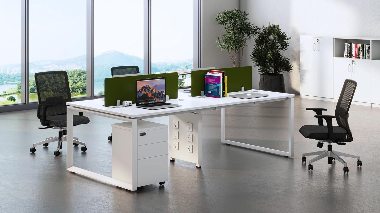 MORI shared workstations with green screens and matching white storage