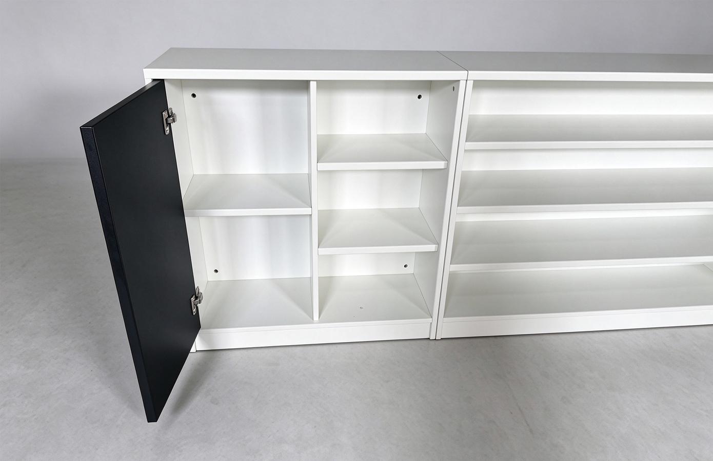Open office storage cabinet showing its shelves and compartments