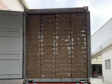Safety net installed across fully loaded container cartons