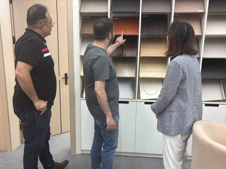 Client and XuSheng team reviewing furniture finishes